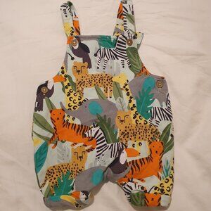 Jungle theme baby dungarees. 1 month.